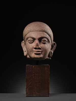 Lot 195 - A LARGE PINK SANDSTONE HEAD OF BUDDHA, MATHURA, KUSHAN PERIOD