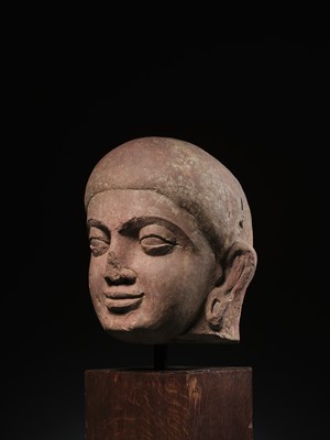 Lot 195 - A LARGE PINK SANDSTONE HEAD OF BUDDHA, MATHURA, KUSHAN PERIOD