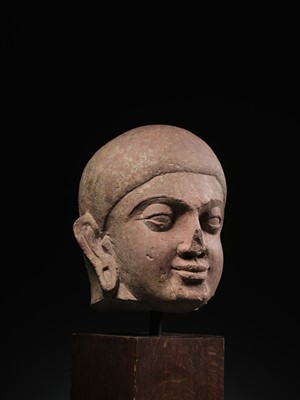 Lot 195 - A LARGE PINK SANDSTONE HEAD OF BUDDHA, MATHURA, KUSHAN PERIOD