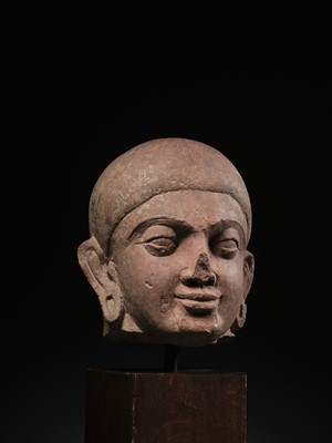 Lot 195 - A LARGE PINK SANDSTONE HEAD OF BUDDHA, MATHURA, KUSHAN PERIOD