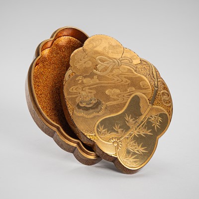 Lot 105 - A FINE LACQUER KOGO (INCENSE BOX) AND COVER IN THE FORM OF A TAKARABUKURO