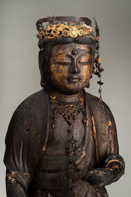 Lot 67 - AN OLD GILT AND LACQUERED WOOD FIGURE OF KANNON