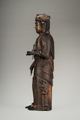 Lot 67 - AN OLD GILT AND LACQUERED WOOD FIGURE OF KANNON
