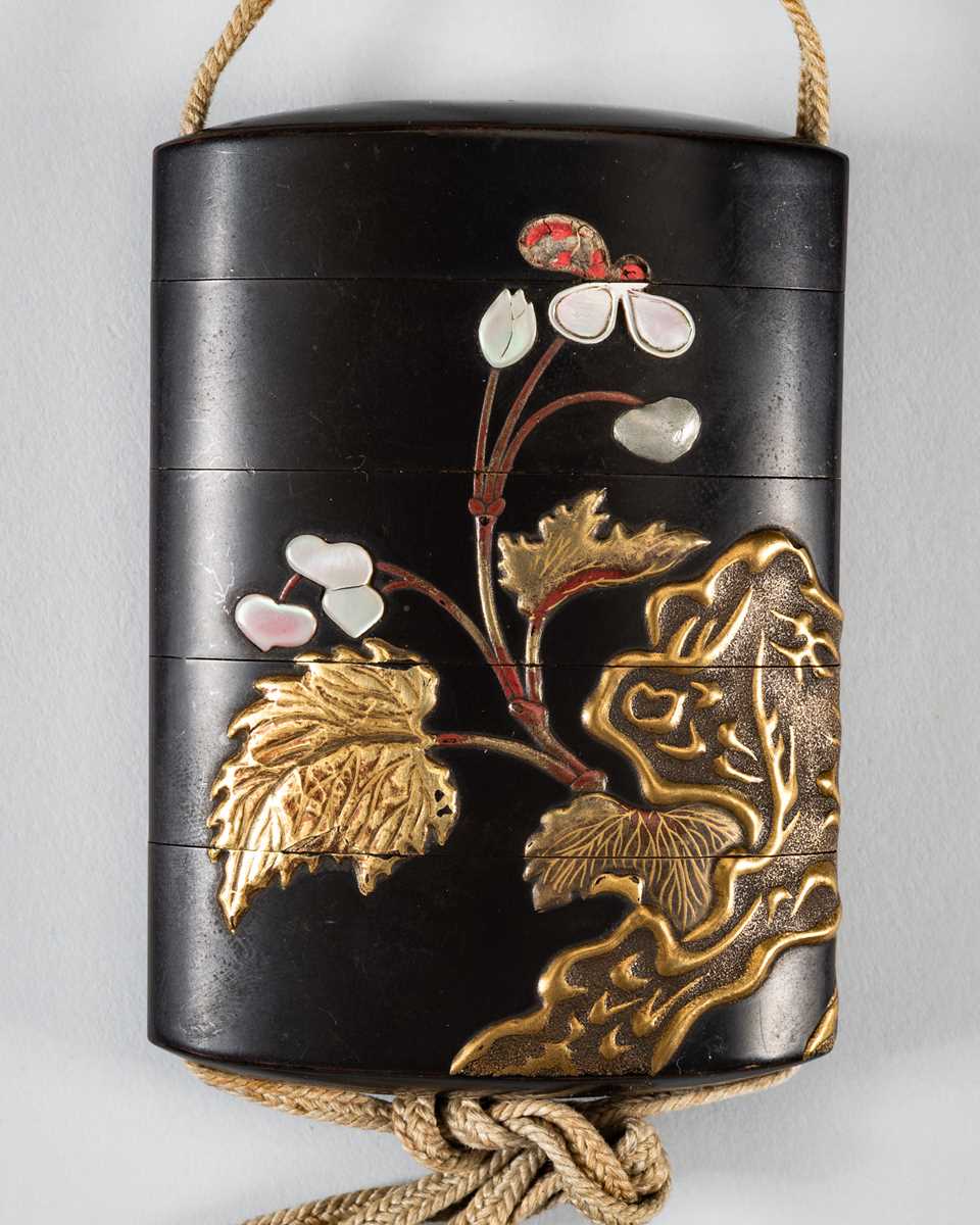 Lot 1428 - A LARGE INLAID FOUR-CASE LACQUER INRO DEPICTING BLOOMING FLOWERS