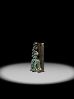 A TURQUOISE-GLAZED FAIENCE AMULET OF SEKHMET NURSING THE YOUNG PHARAOH, LATE PERIOD TO PTOLEMAIC ERA