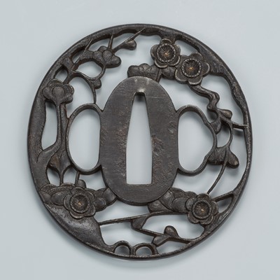 Lot 1560 - AN IRON SUKASHI TSUBA WITH CHERRY BLOSSOMS