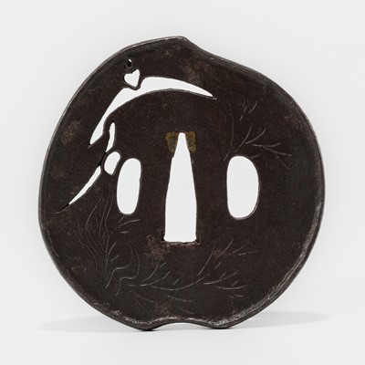 Lot 1496 - NOBUIE: AN IRON SUKASHI TSUBA IN FORM OF A PEACH