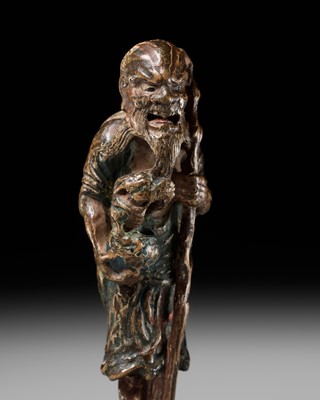 Lot 64 - A POWERFUL SAISHIKI NETSUKE OF AN IMMORTAL WITH DRAGON, SOKEN KISHO TYPE, ATTRIBUTED TO YOSHIMURA SHUZAN