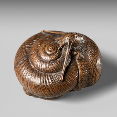 Lot 159 - TADATOSHI: A FINE NAGOYA SCHOOL WOOD NETSUKE OF A SNAIL