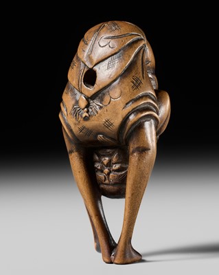 Lot 443 - AN UNUSUAL WOOD NETSUKE OF AN ACROBATIC SOUTH SEA ISLANDER