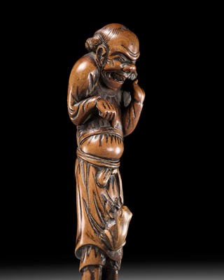 Lot 68 - A TALL WOOD NETSUKE OF GAMA SENNIN