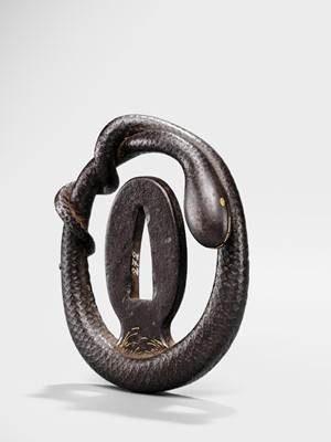 Lot 52 - A RARE IRON MYOCHIN SCHOOL SUKASHI TSUBA IN THE FORM OF A SNAKE