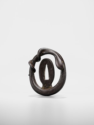 Lot 52 - A RARE IRON MYOCHIN SCHOOL SUKASHI TSUBA IN THE FORM OF A SNAKE