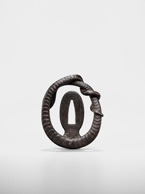 Lot 52 - A RARE IRON MYOCHIN SCHOOL SUKASHI TSUBA IN THE FORM OF A SNAKE