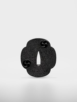 Lot 94 - A FINE LACQUERED WOOD TSUBA WITH MITSUTOMO-E MON
