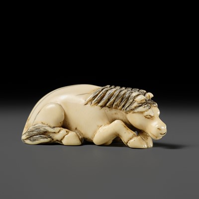 Lot 91 - A GOOD KYOTO SCHOOL IVORY NETSUKE OF A RECUMBENT HORSE