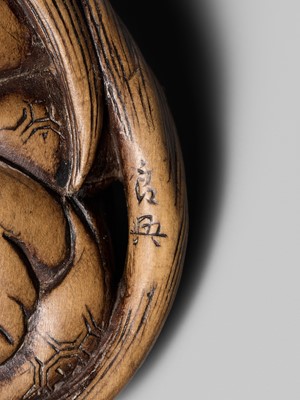 Lot 192 - YOSHIOKI: A SUPERB WOOD NETSUKE OF A SLEEPING SHOJO