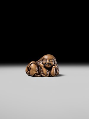 Lot 192 - YOSHIOKI: A SUPERB WOOD NETSUKE OF A SLEEPING SHOJO