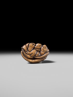 Lot 192 - YOSHIOKI: A SUPERB WOOD NETSUKE OF A SLEEPING SHOJO