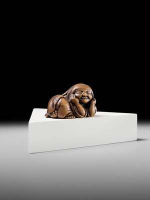 Lot 192 - YOSHIOKI: A SUPERB WOOD NETSUKE OF A SLEEPING SHOJO