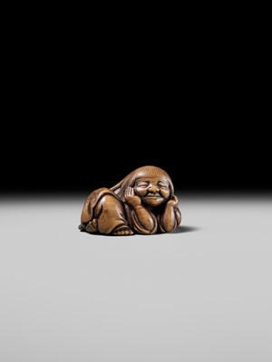 Lot 192 - YOSHIOKI: A SUPERB WOOD NETSUKE OF A SLEEPING SHOJO