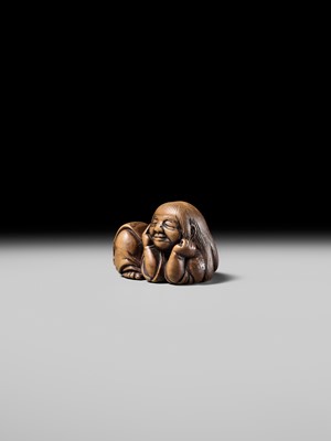 Lot 192 - YOSHIOKI: A SUPERB WOOD NETSUKE OF A SLEEPING SHOJO