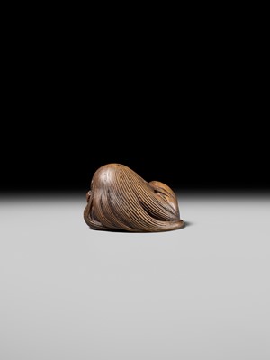 Lot 192 - YOSHIOKI: A SUPERB WOOD NETSUKE OF A SLEEPING SHOJO