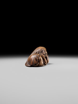 Lot 192 - YOSHIOKI: A SUPERB WOOD NETSUKE OF A SLEEPING SHOJO