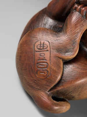 Lot 162 - NAITO TOYOMASA: A SUPERB WOOD NETSUKE OF A PUPPY SCRATCHING ITSELF