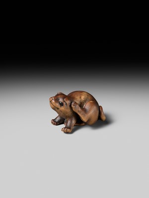 Lot 162 - NAITO TOYOMASA: A SUPERB WOOD NETSUKE OF A PUPPY SCRATCHING ITSELF