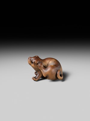 Lot 162 - NAITO TOYOMASA: A SUPERB WOOD NETSUKE OF A PUPPY SCRATCHING ITSELF