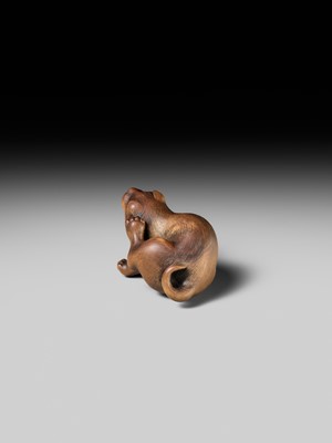 Lot 162 - NAITO TOYOMASA: A SUPERB WOOD NETSUKE OF A PUPPY SCRATCHING ITSELF