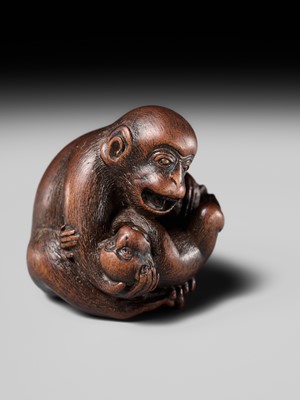 Lot 114 - MASANAO: A SUPERB WOOD NETSUKE OF A MONKEY WITH YOUNG