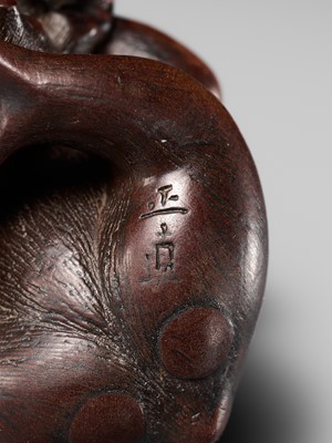 Lot 114 - MASANAO: A SUPERB WOOD NETSUKE OF A MONKEY WITH YOUNG