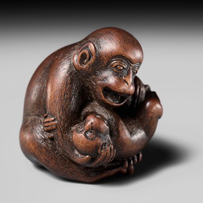 Lot 114 - MASANAO: A SUPERB WOOD NETSUKE OF A MONKEY WITH YOUNG