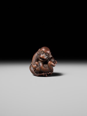 Lot 114 - MASANAO: A SUPERB WOOD NETSUKE OF A MONKEY WITH YOUNG