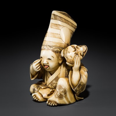 Lot 496 - AN IVORY NETSUKE OF A BOY WITH MOVABLE TONGUE