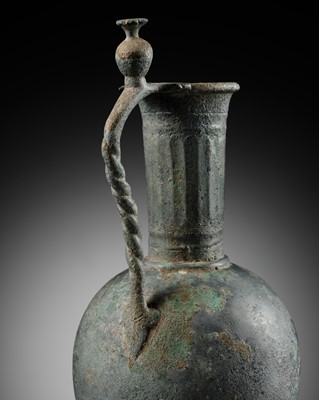 Lot 368 - AN UMAYYAD OR EARLY ABBASID BRONZE EWER, 8TH-9TH CENTURY