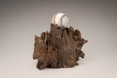 Lot 759 - AN AGAR WOOD ‘SCHOLAR’S ROCK’ WITH A SPHERE, QING