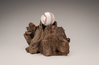 Lot 759 - AN AGAR WOOD ‘SCHOLAR’S ROCK’ WITH A SPHERE, QING