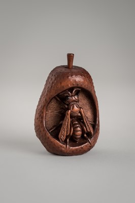 Lot 1423 - VADYM PYVOVAR: A WOOD NETSUKE OF A WASP INSIDE A DECAYING PEAR