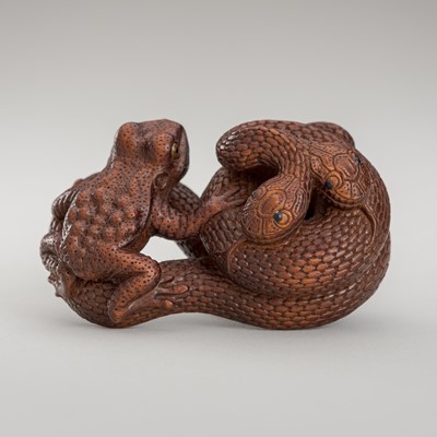 Lot 1374 - VADYM PYVOVAR: A WOOD NETSUKE OF A SNAKE WITH FROG