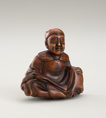 Lot 1332 - A WOOD NETSUKE OF A SCHOLAR