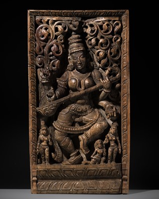 Lot 353 - A LARGE WOOD RELIEF OF SARASVATI, SOUTH INDIA, 19TH CENTURY OR EARLIER