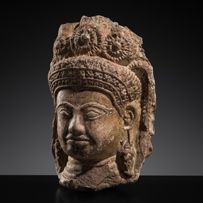 Lot 663 - A POTTERY HEAD OF A DEITY