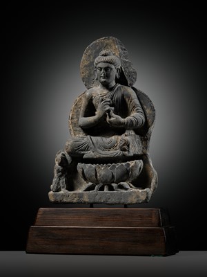Lot 391 - A GRAY SCHIST FIGURE OF BUDDHA TEACHING HIS FIRST SERMON, ANCIENT REGION OF GANDHARA, 3RD-4TH CENTURY