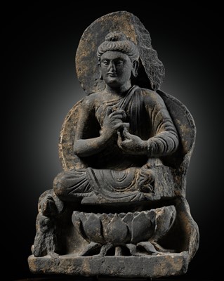 Lot 391 - A GRAY SCHIST FIGURE OF BUDDHA TEACHING HIS FIRST SERMON, ANCIENT REGION OF GANDHARA, 3RD-4TH CENTURY