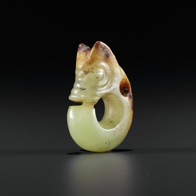 Lot 426 - A SMALL YELLOW AND RUSSET JADE ‘PIG DRAGON’, ZHULONG, HONGSHAN CULTURE