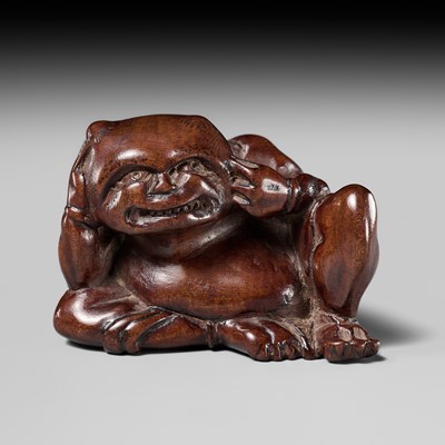 Lot 215 - MIWA: A RARE WOOD NETSUKE OF A SEATED ONI