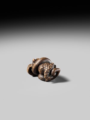 Lot 120 - MASANAO: A FINE WOOD NETSUKE OF A SNAKE PREYING ON A FROG, SANSUKUMI